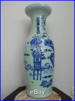 A large 19th century celadon ground vase with a blue decoration of antiquiteis