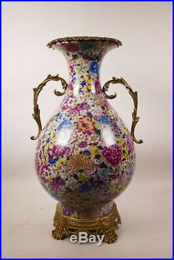 A large Chinese polychrome porcelain vase with ormolu style mounts and handles