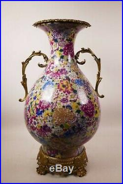 A large Chinese polychrome porcelain vase with ormolu style mounts and handles