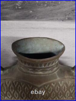 Large bronze archaic style vase with hatched pattern and loop handles, open base